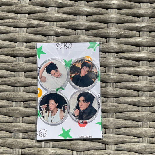 4 buttons with images of a man on a woven surface