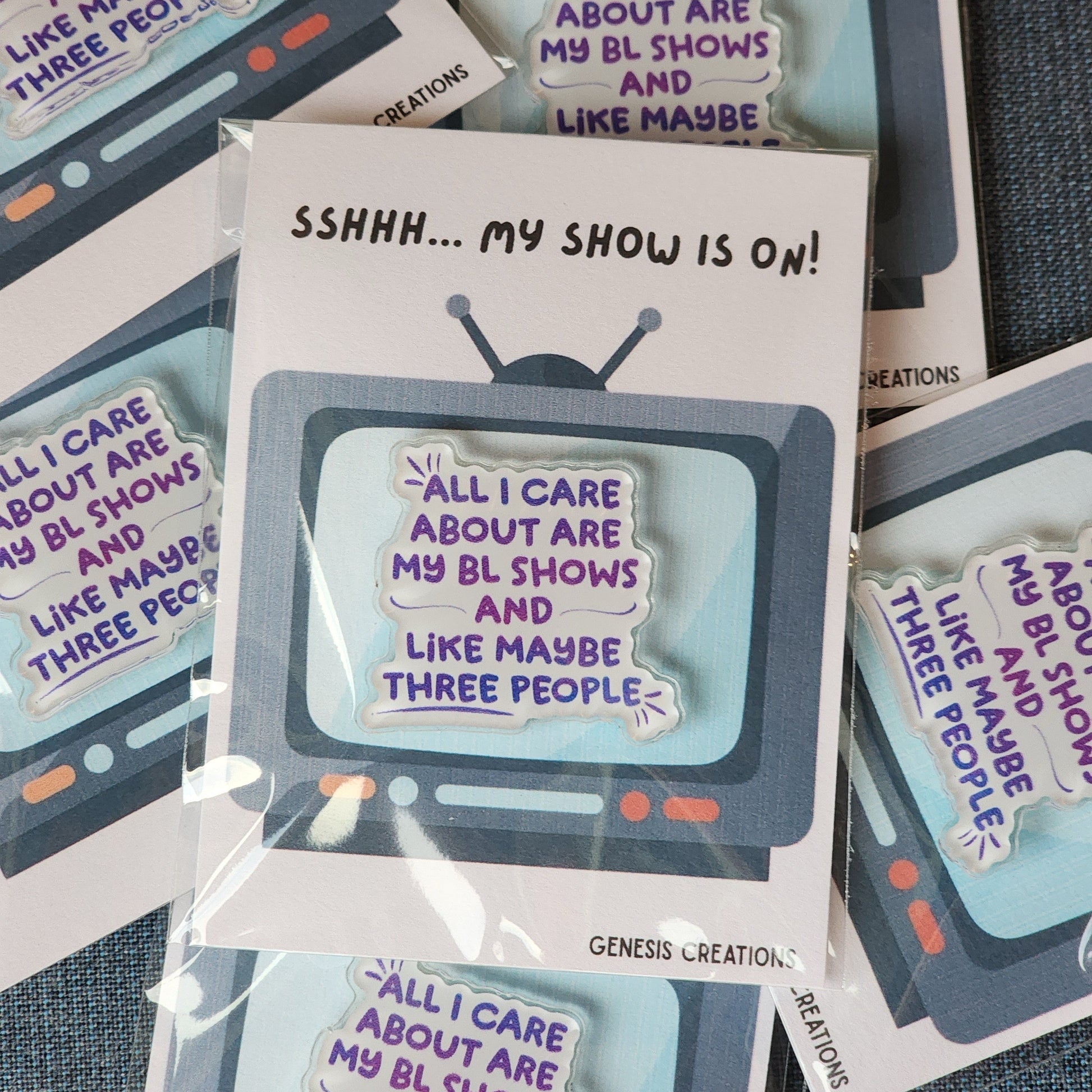 Packaged acrylics pins with TV design and text 'Sshh... My show is on. 