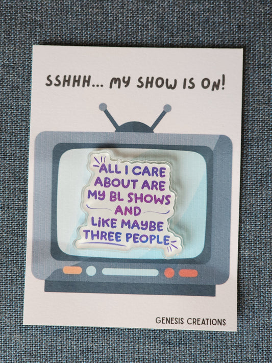 Card with a retro TV graphic and humorous text about a show, on a textured surface.